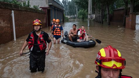 Deadly flooding in China worsens as rescues continue and areas downriver brace for high water
